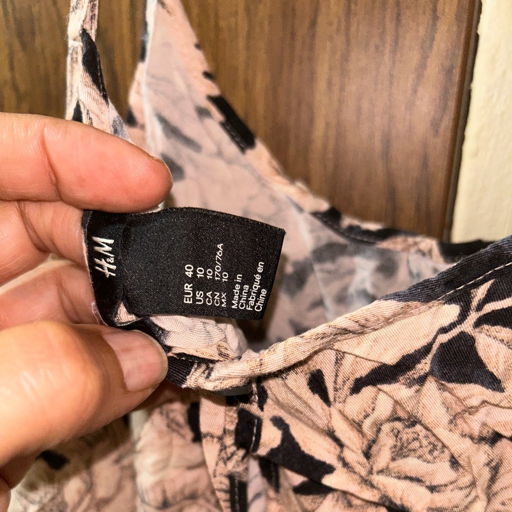 H&M romper size 10 with flower and black design